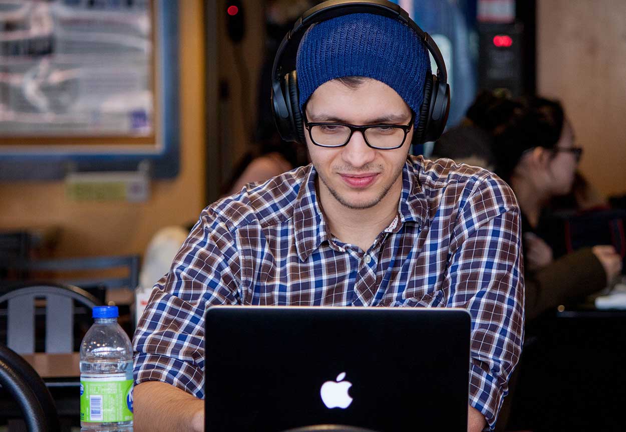 Car buyer googling tips for buying a used car on macbook