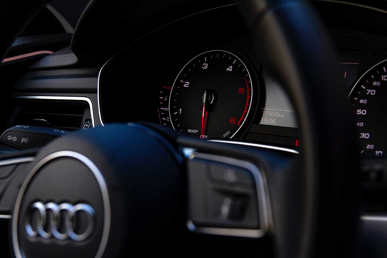 dashboard of an audi car showing indicators to help with car maintenance