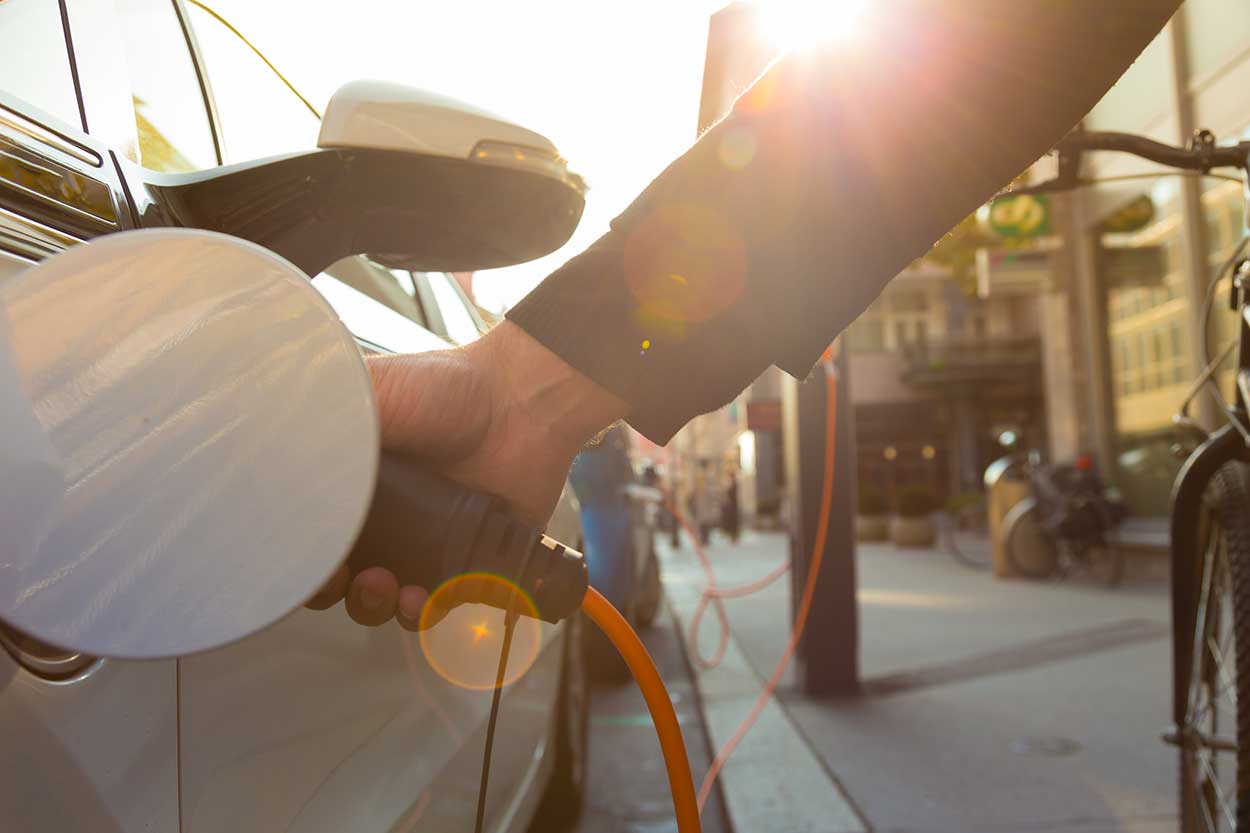 Man recharges Ultra Low Emission Vehicle in UK