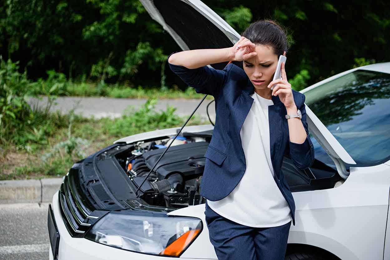 woman calling for breakdown advice at roadside