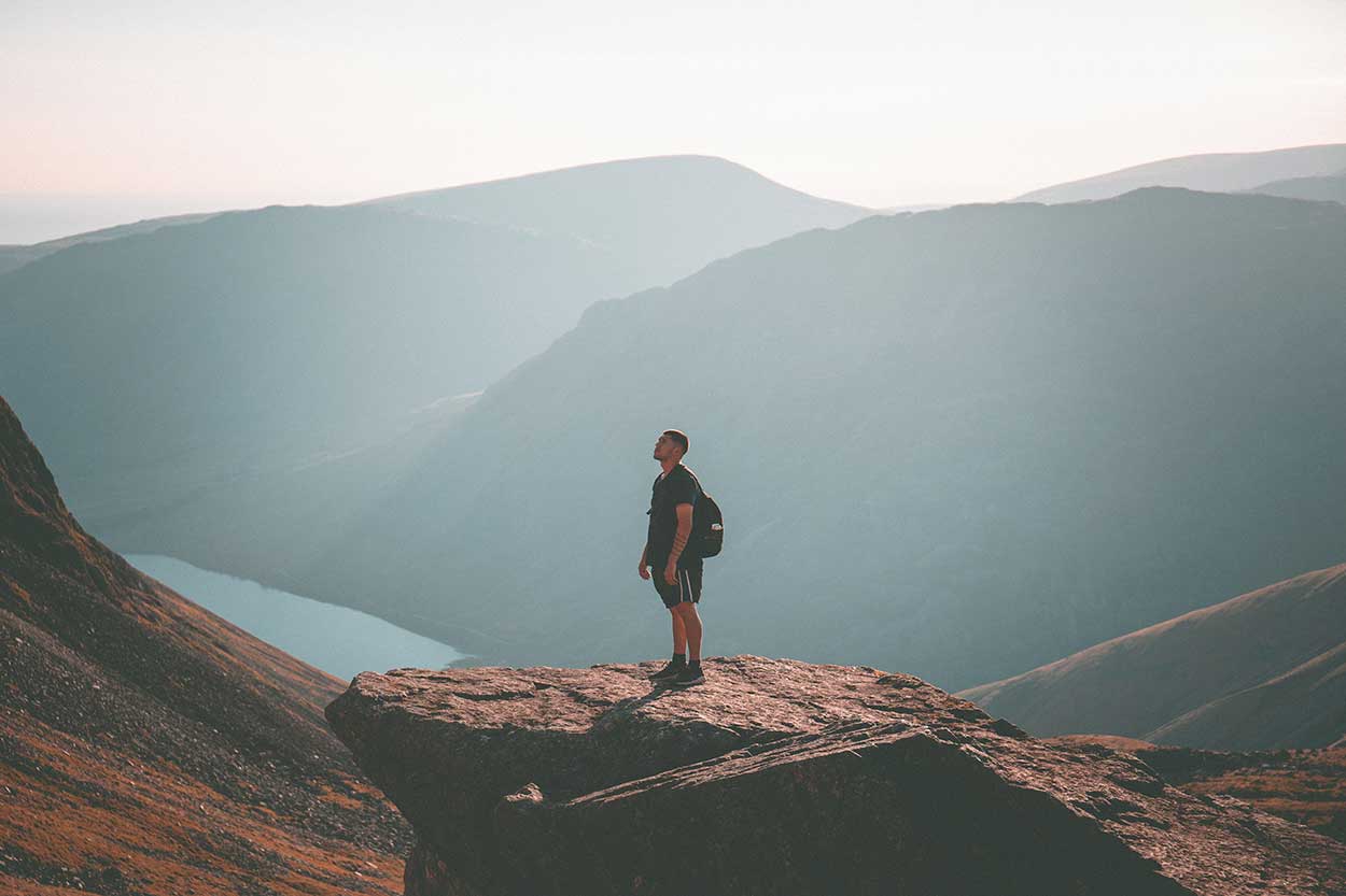 man standing on skafell pike in the lake district