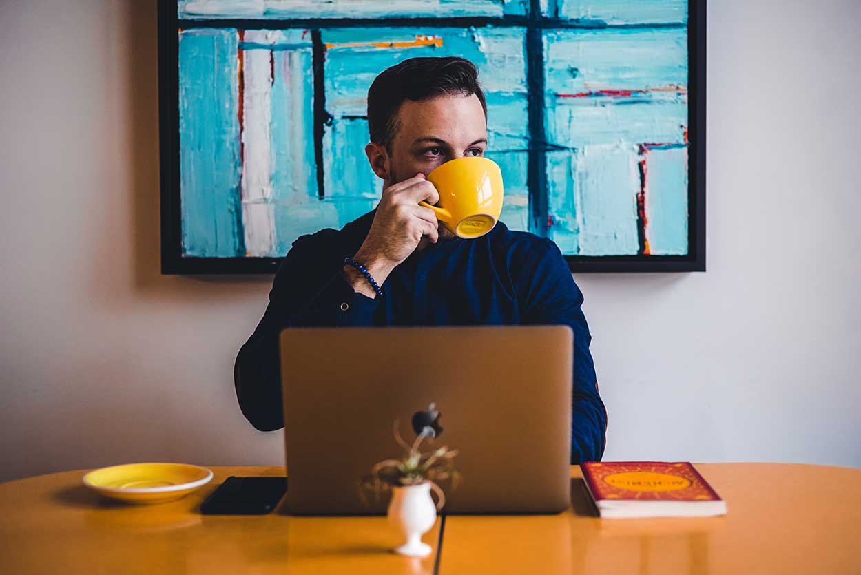 man using laptop to apply for car finance with soft search