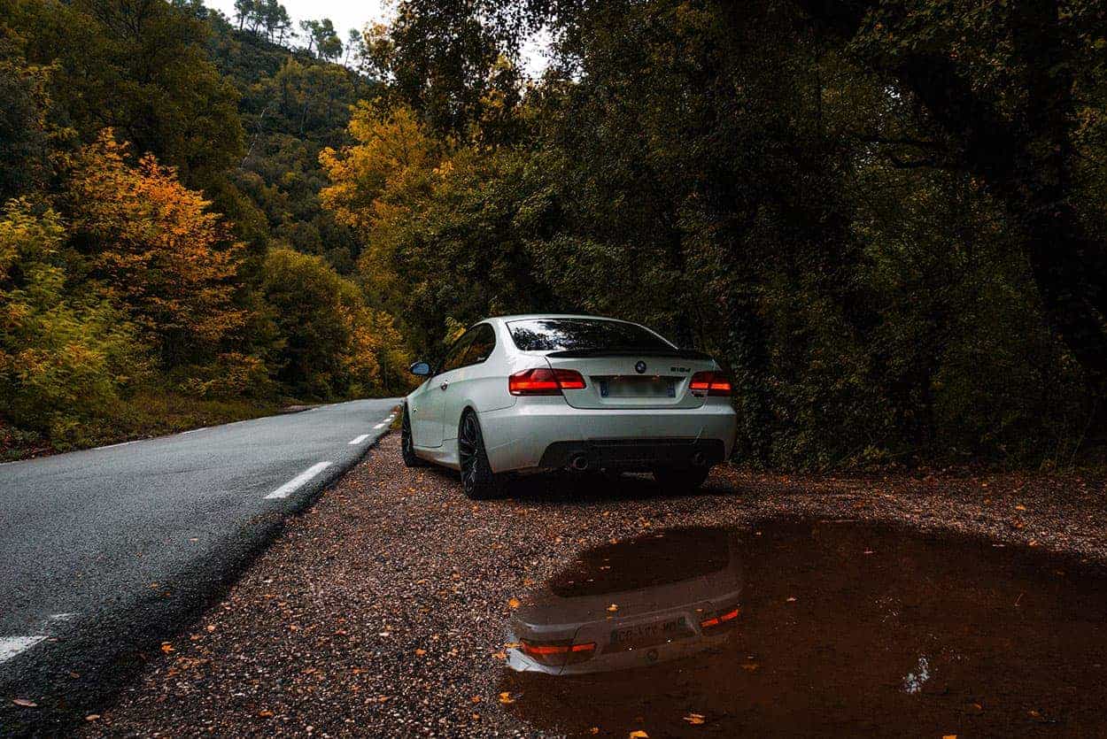 white bmw making use of autumn accessories for your car