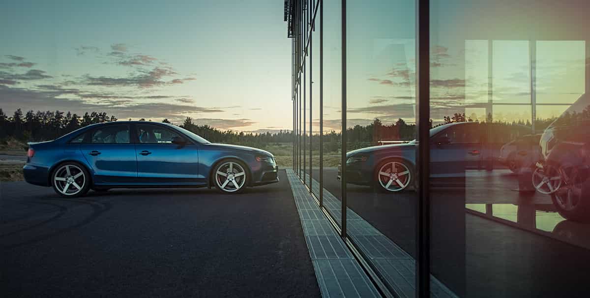 Car outside dealership after considering when is the best time to buy a car