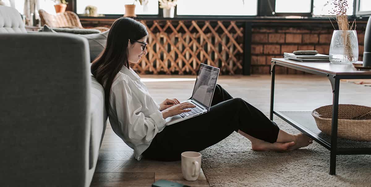 Woman using a laptop getting the best car finance for her