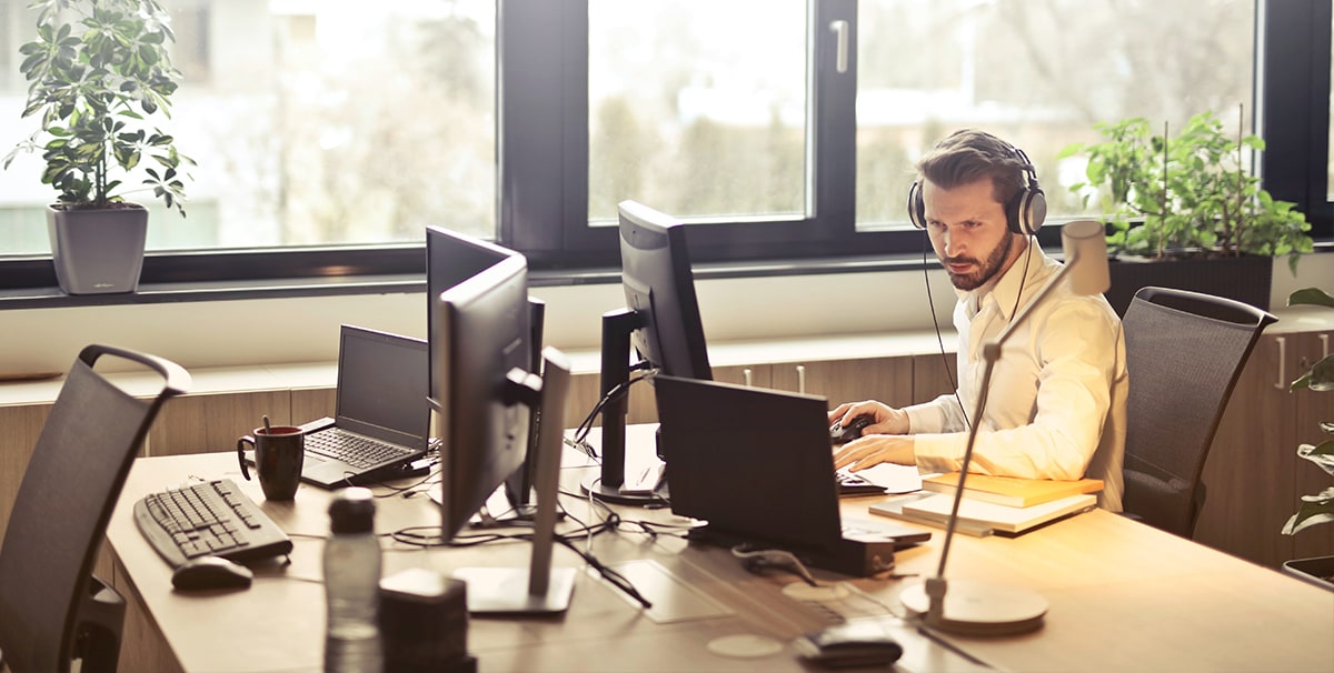 Man in office after commuting to work