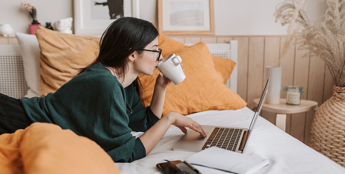 woman on laptop googling what is car subscription model