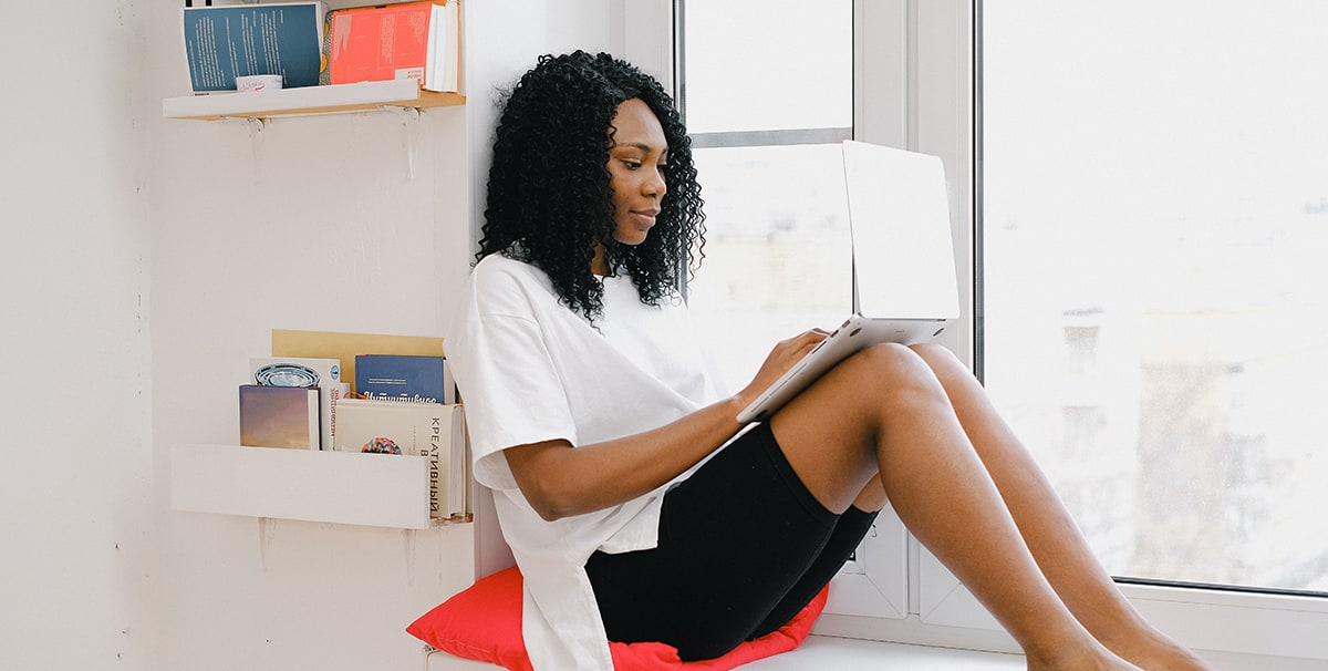 Woman researching how to sell a car on finance