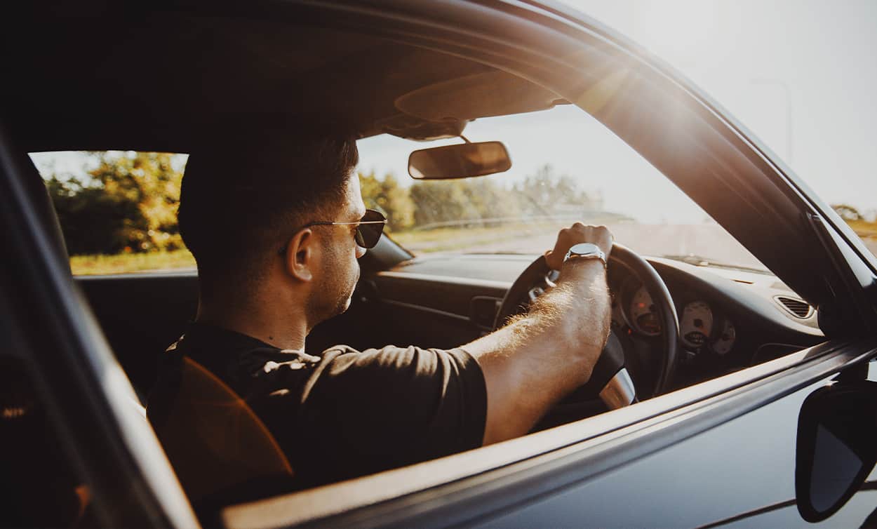 Man driving in a used car