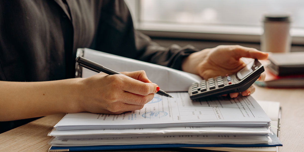 Woman using calculator