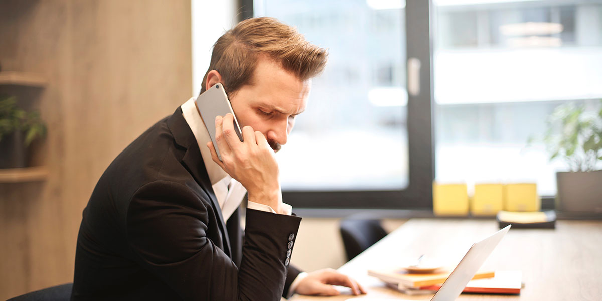 Man getting finance on phone with poor credit