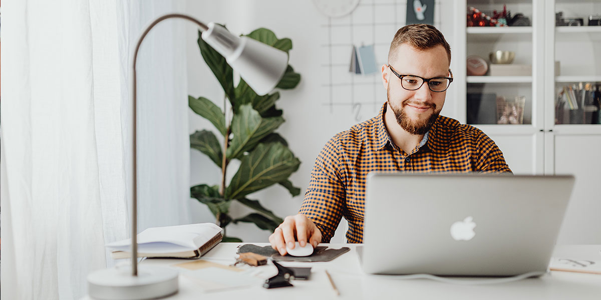 Man using laptop to check his finance