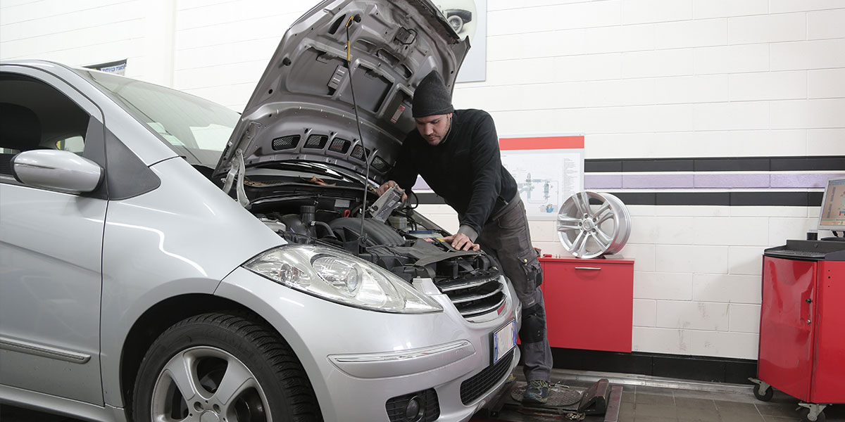 Mecanic fixing a used car