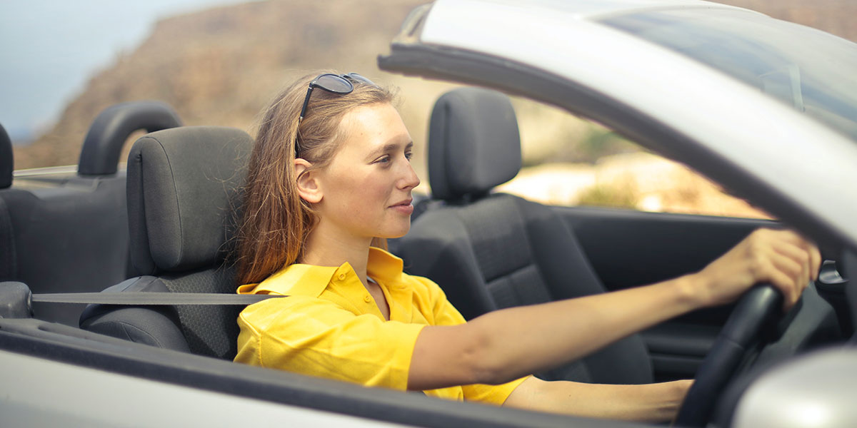 Woman driving in a used car