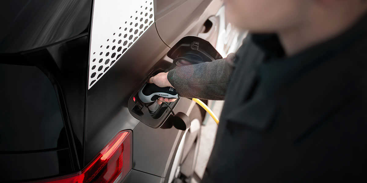 Person charging up their EV