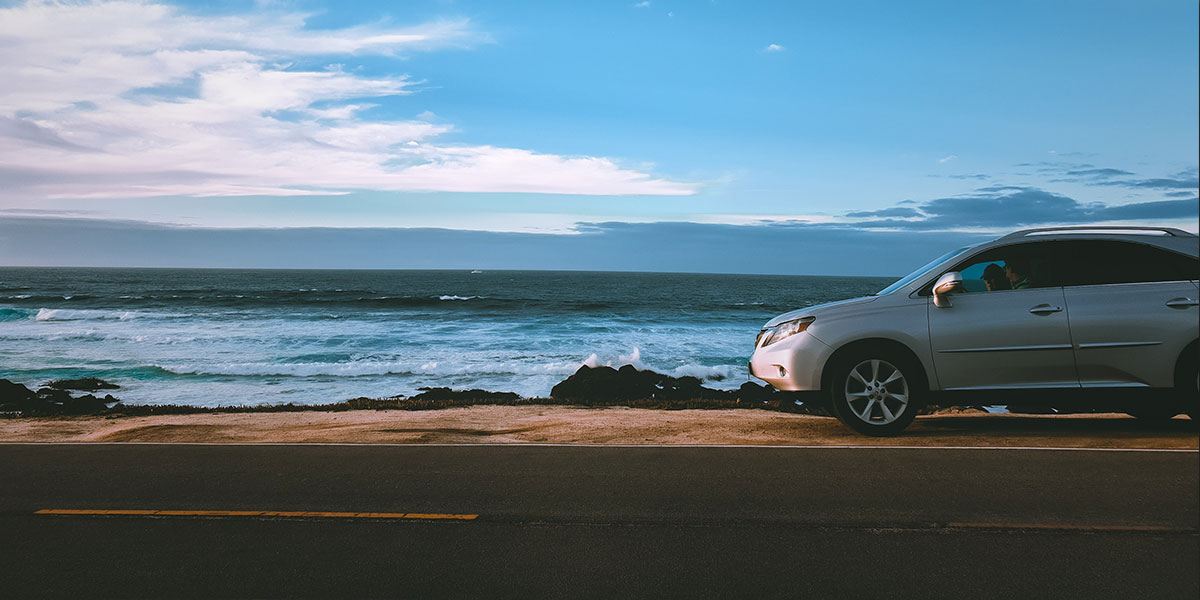 Fun summer car parked by the beach