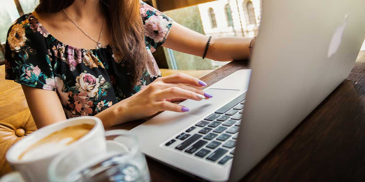 Woman buying a car on her laptop