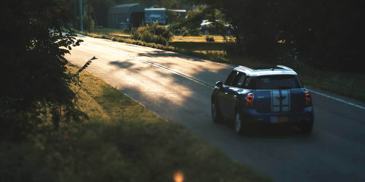 Mini driving down a country road