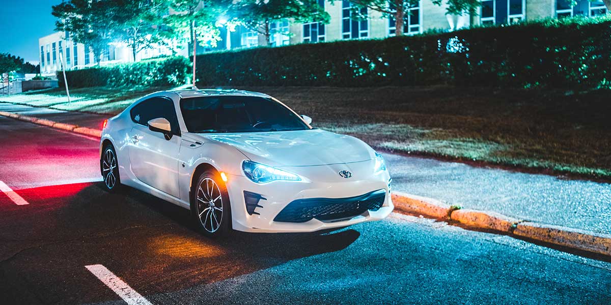 White car driven at night