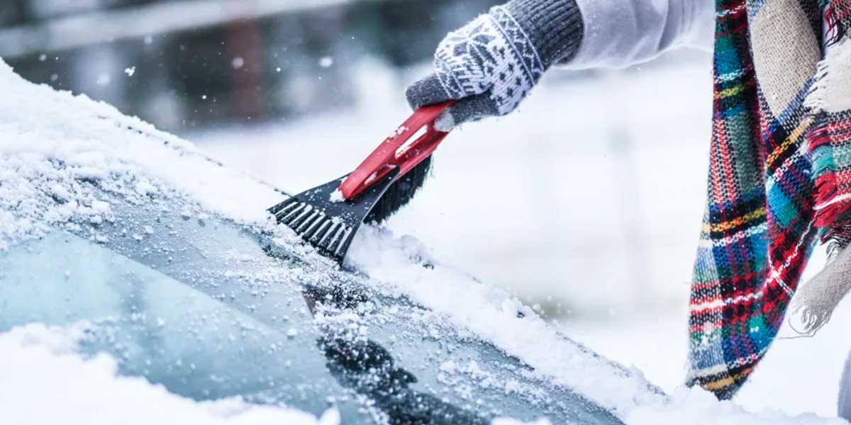 Scraping frozen windshield