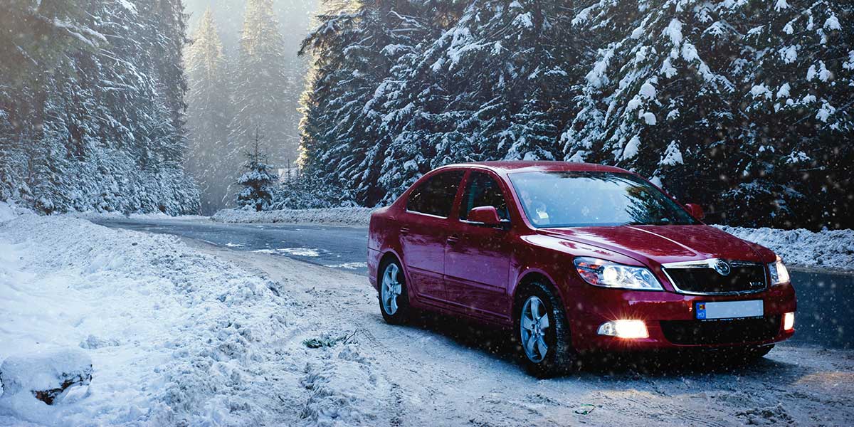 Skoda by the road in the snow