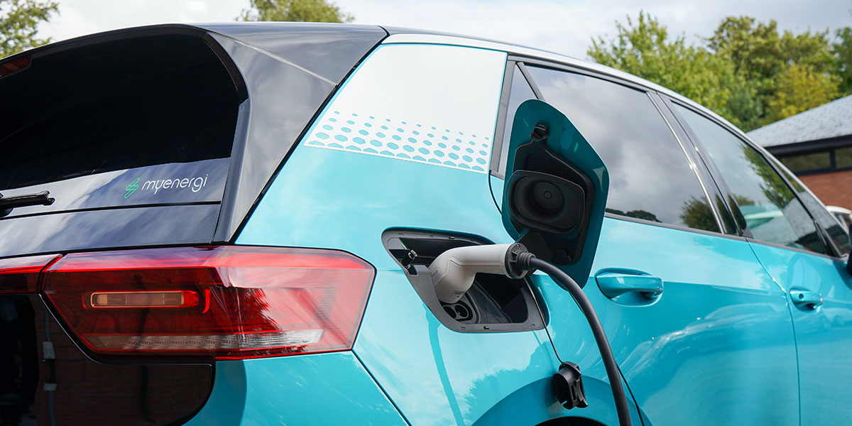 Electric car being charged at a charge point