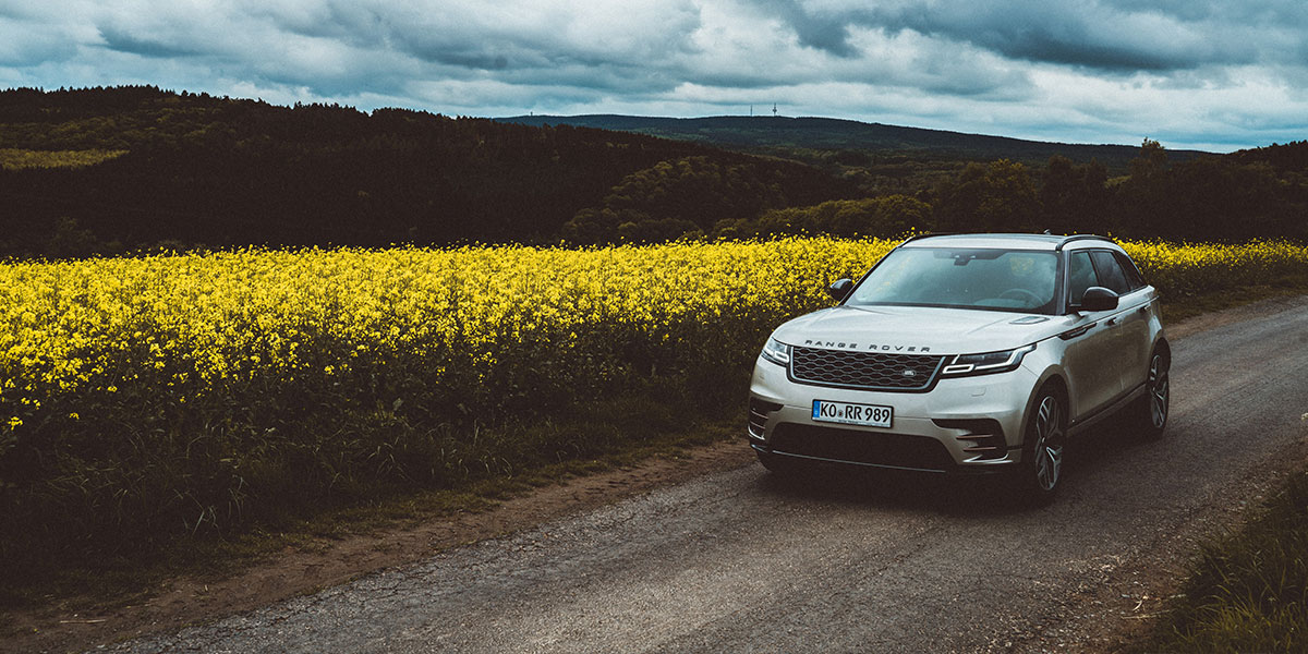 Range rover driving through countryside