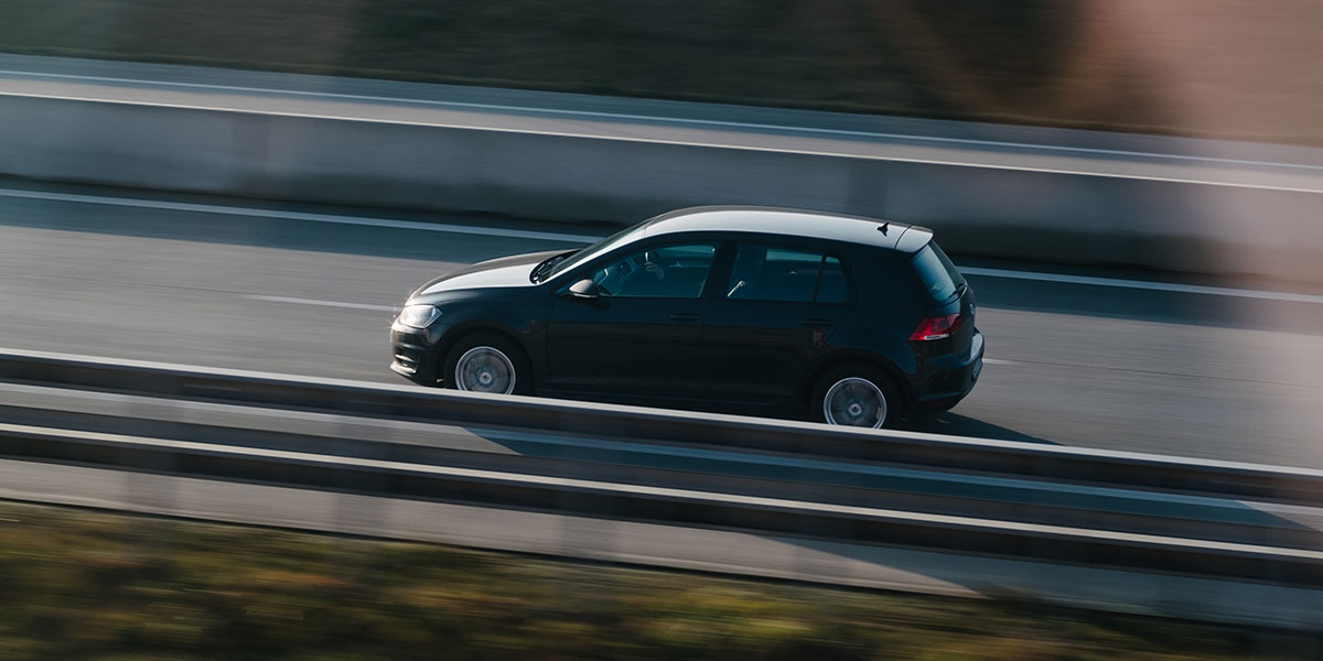 VW Golf driving on the road