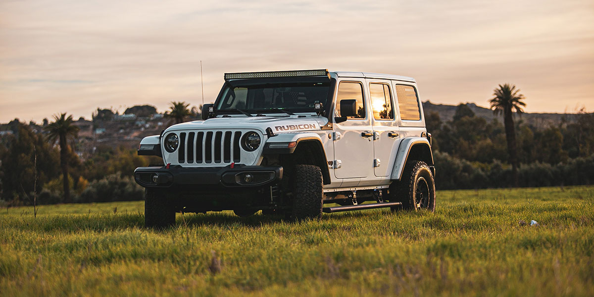 Jeep on a grassy hill