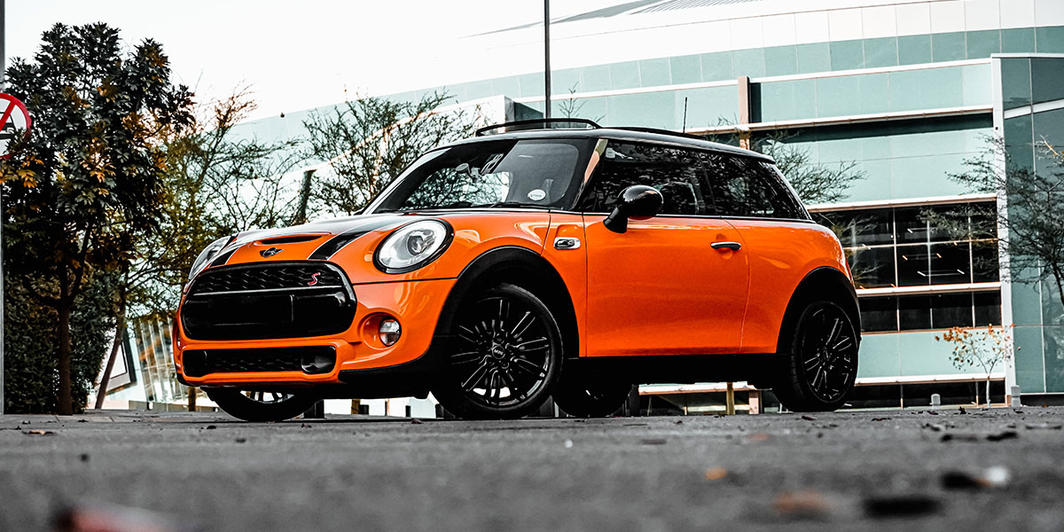 Orange mini in car park