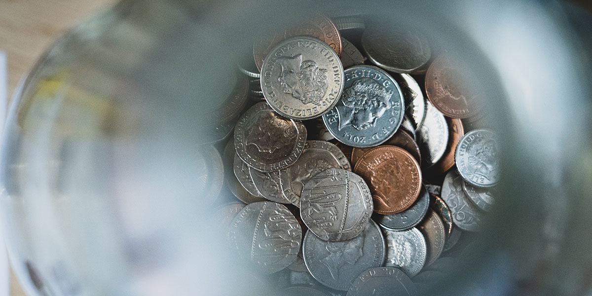 Savings jar containing coins