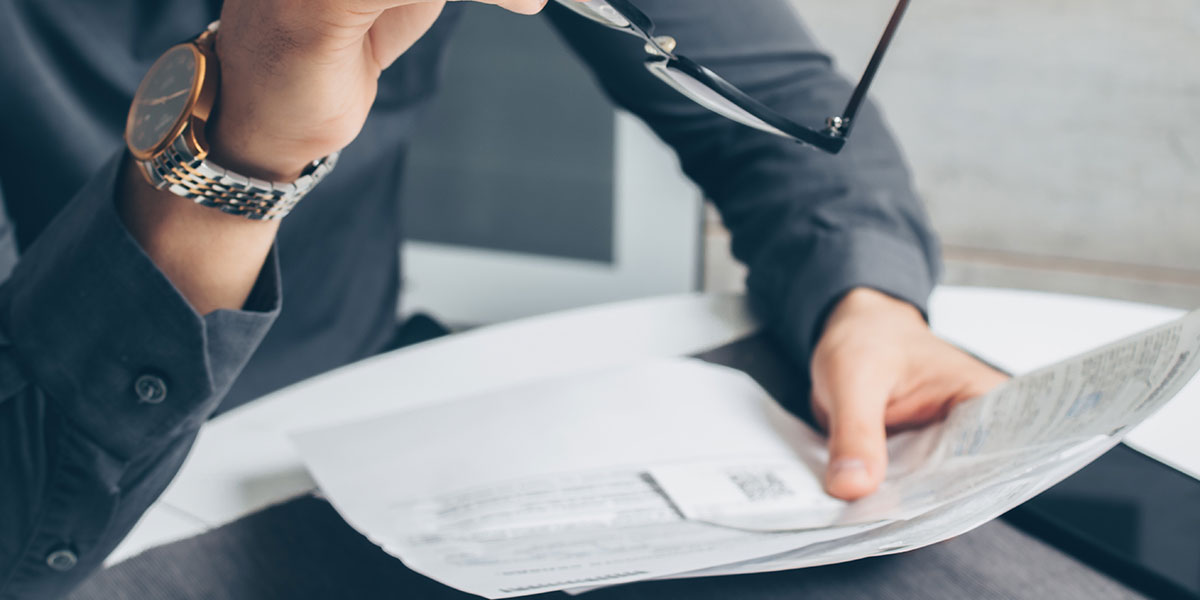 Person looking at a letter