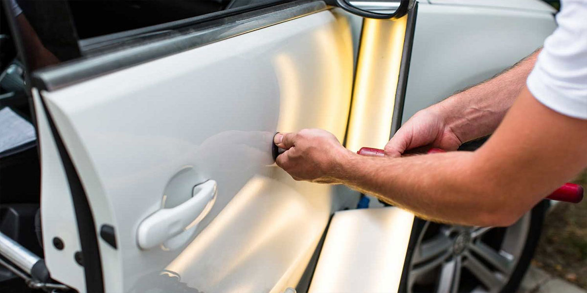 Fixing a dent in a white car