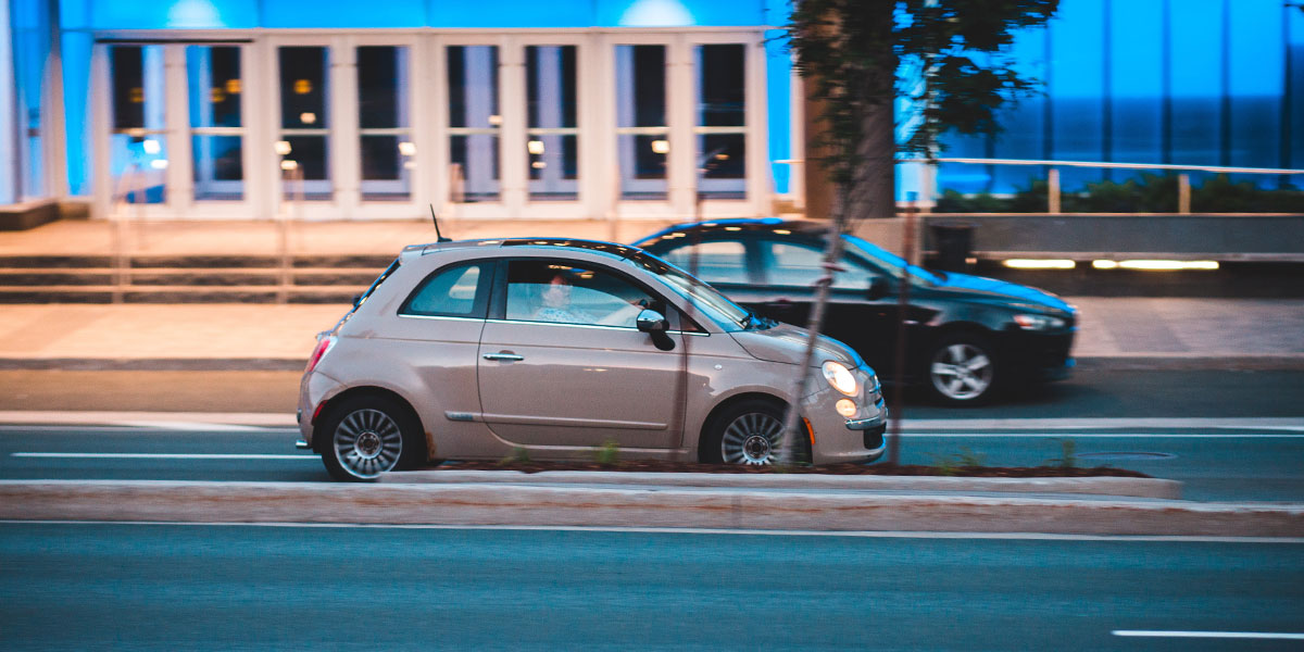 Fiat 500 driving through town