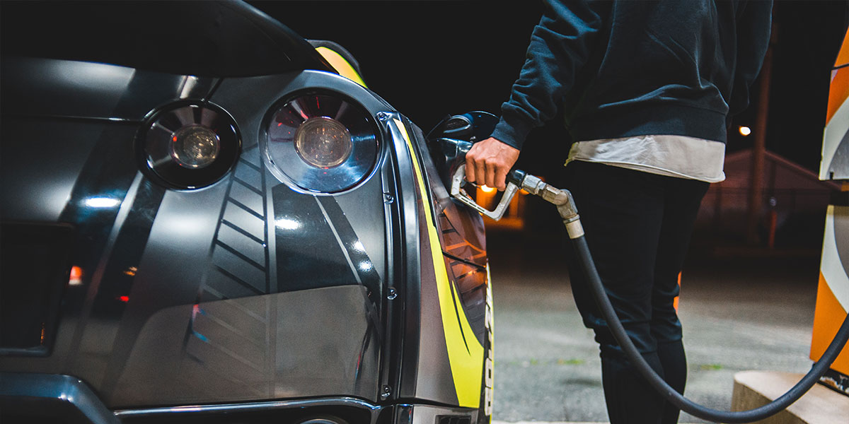 Man filling up car at a petrol station