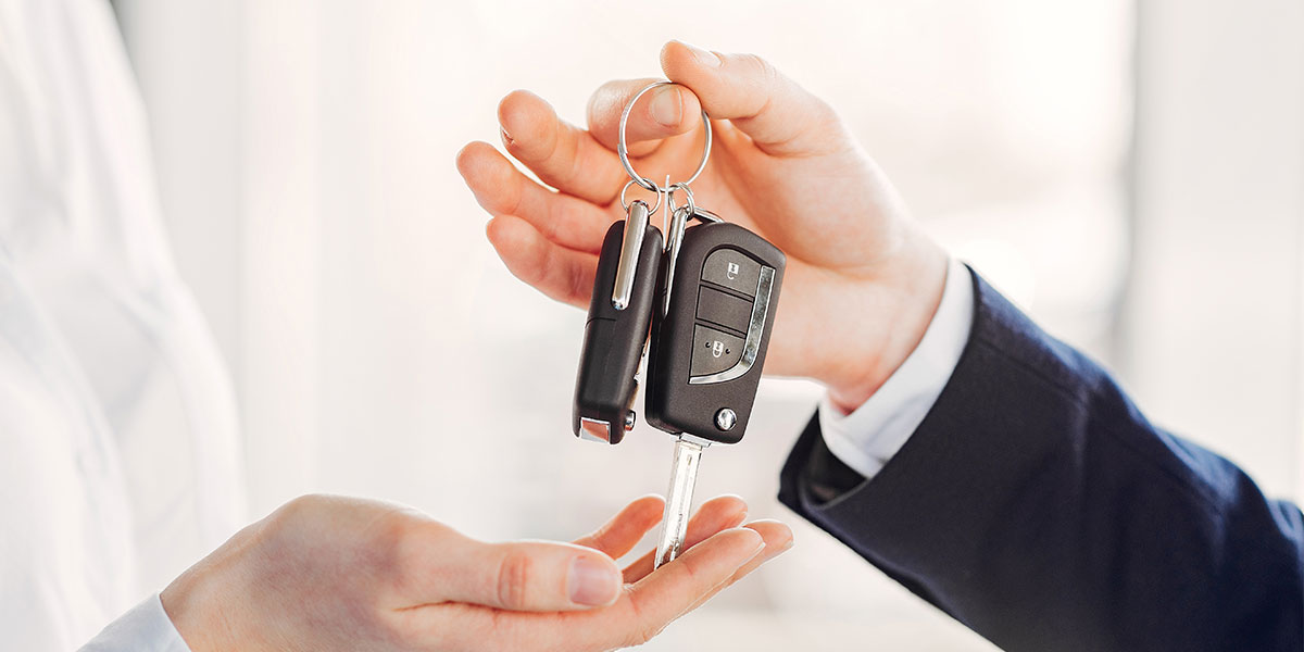 Car keys being handed over