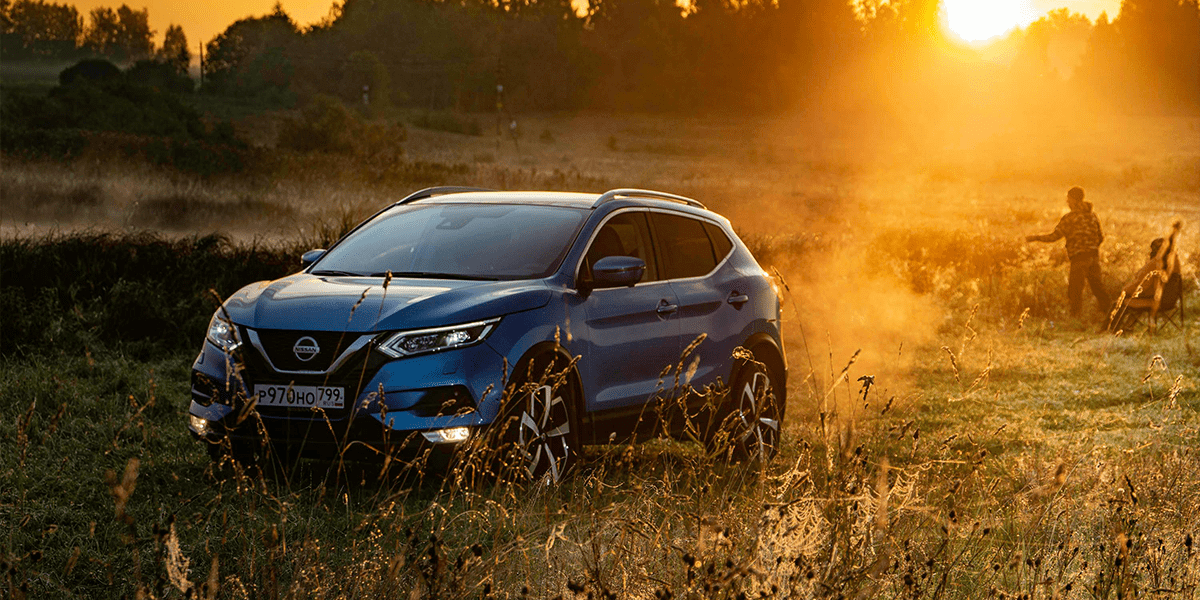 Car in sunset with people camping all bought on Hire Purchase