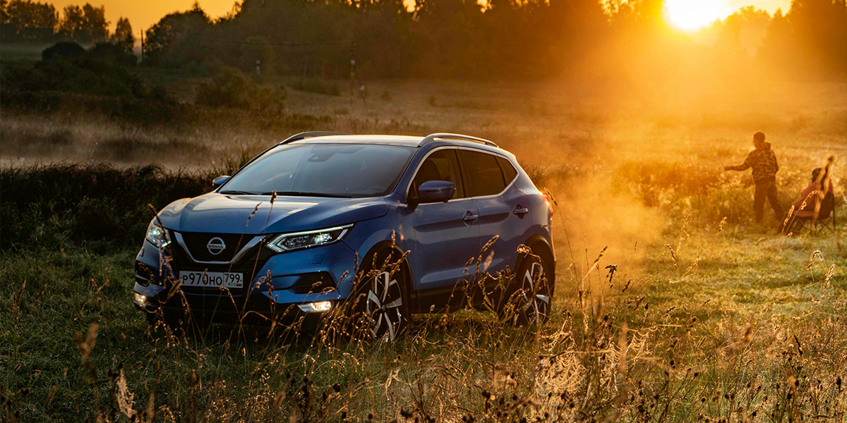 Car in sunset with people camping all bought on Hire Purchase