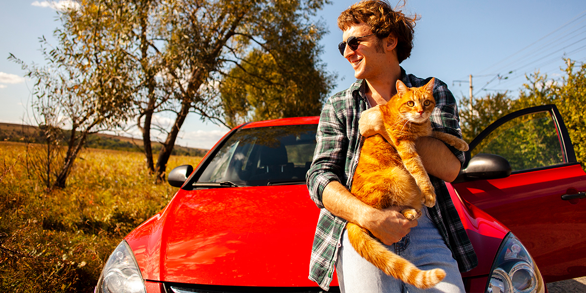 Man with car in front of car bought on HP with no deposit