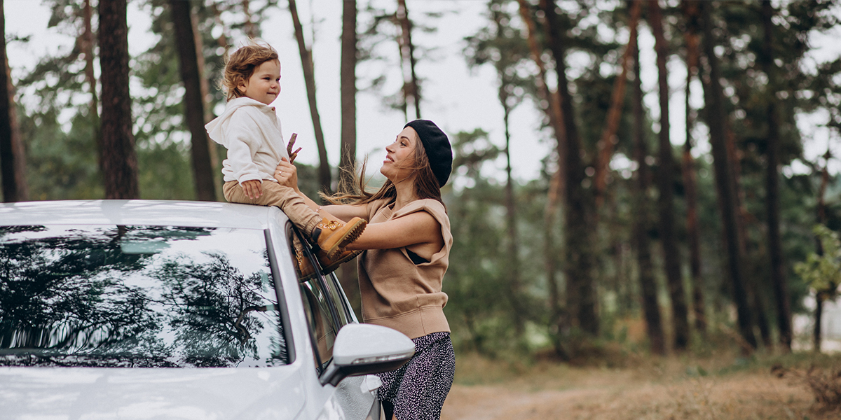 Mother and child in park after discovering how car deposits work