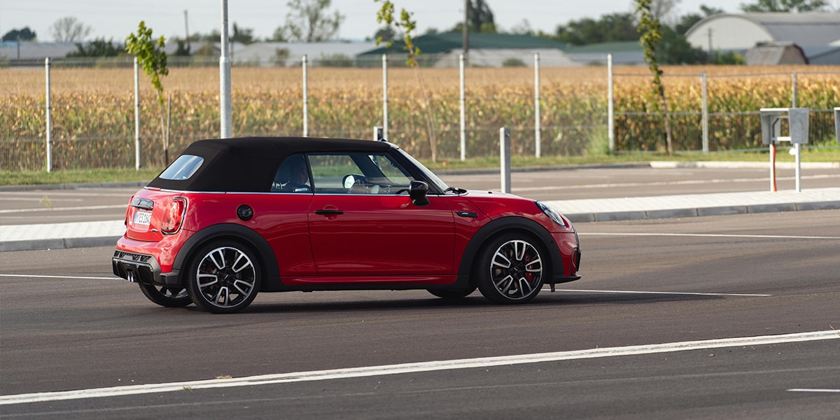 Red used mini in carpark