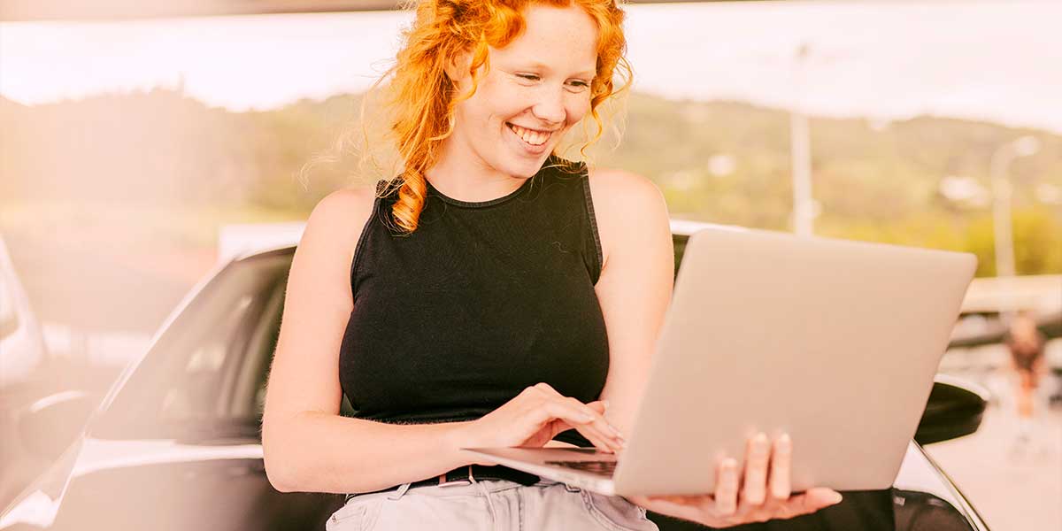 Woman checking her credit score on laptop