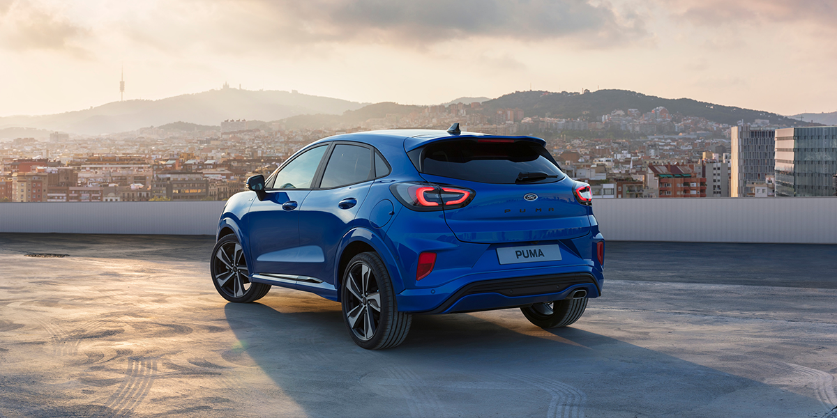 Blue Hybrid car on a rooftop