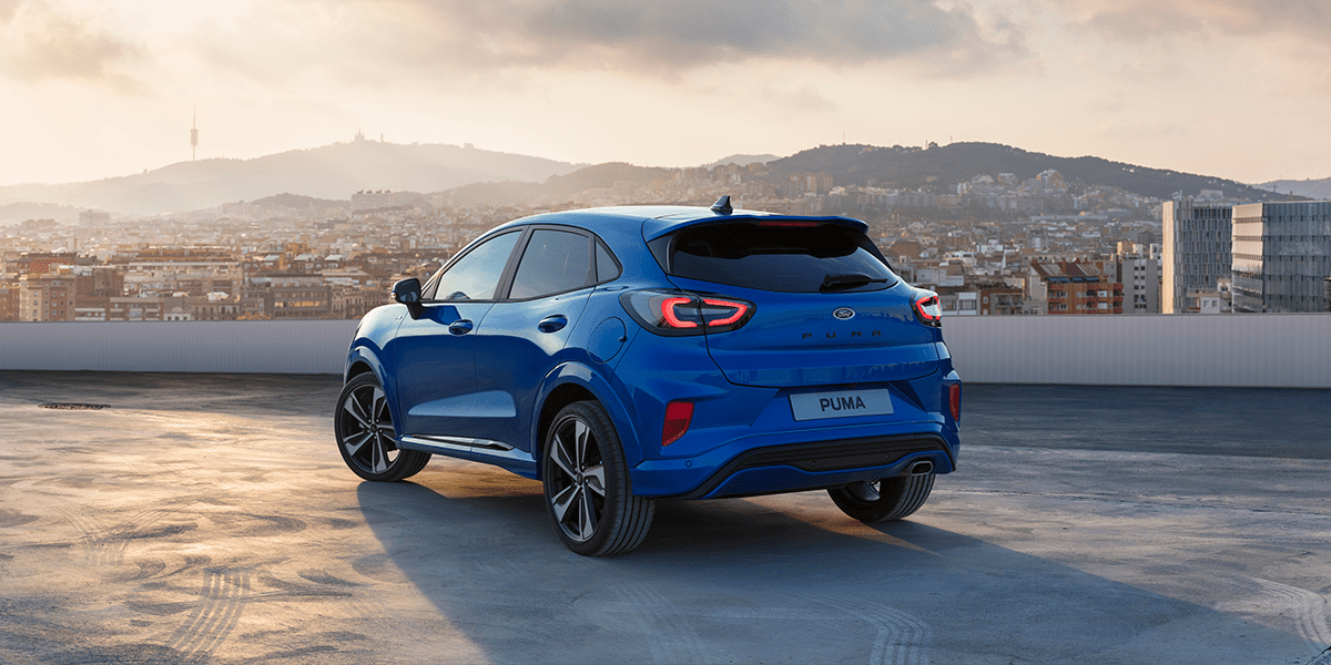 Blue Hybrid car on a rooftop