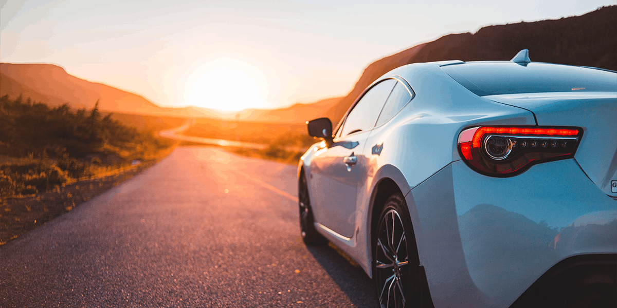new white car at sunset